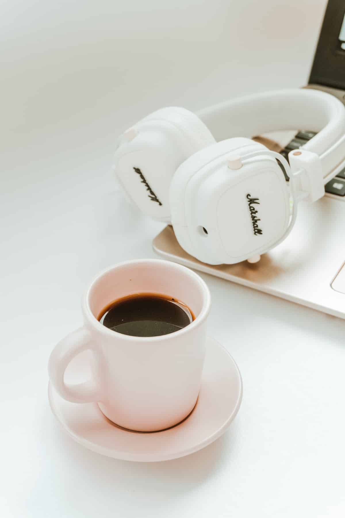 coffee, headphones, and laptop