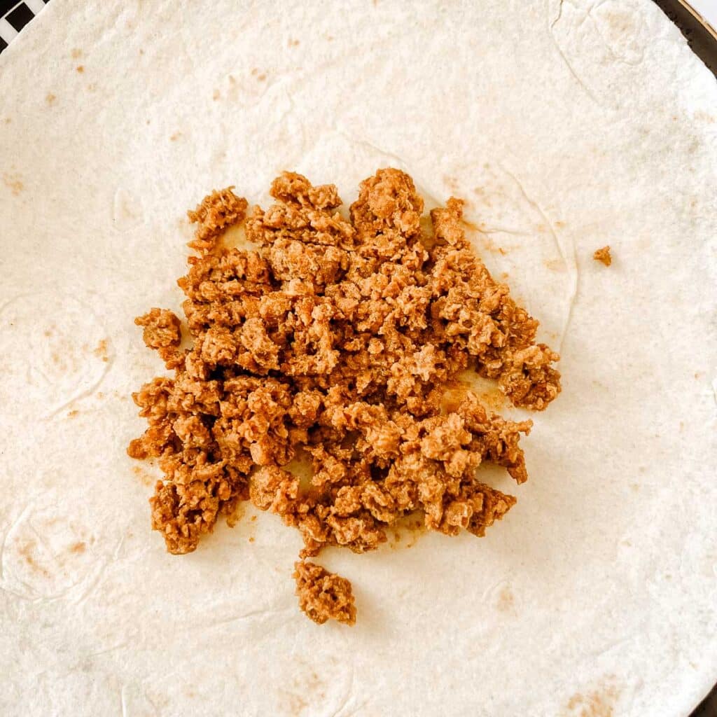 tortilla with taco meat in the center