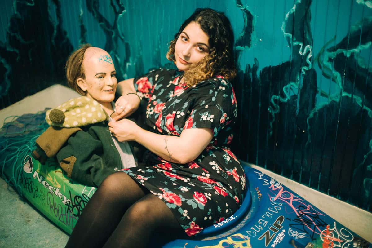 me sitting in a canoe with a mannequin inside Rimsky Korsakoffee House bathroom