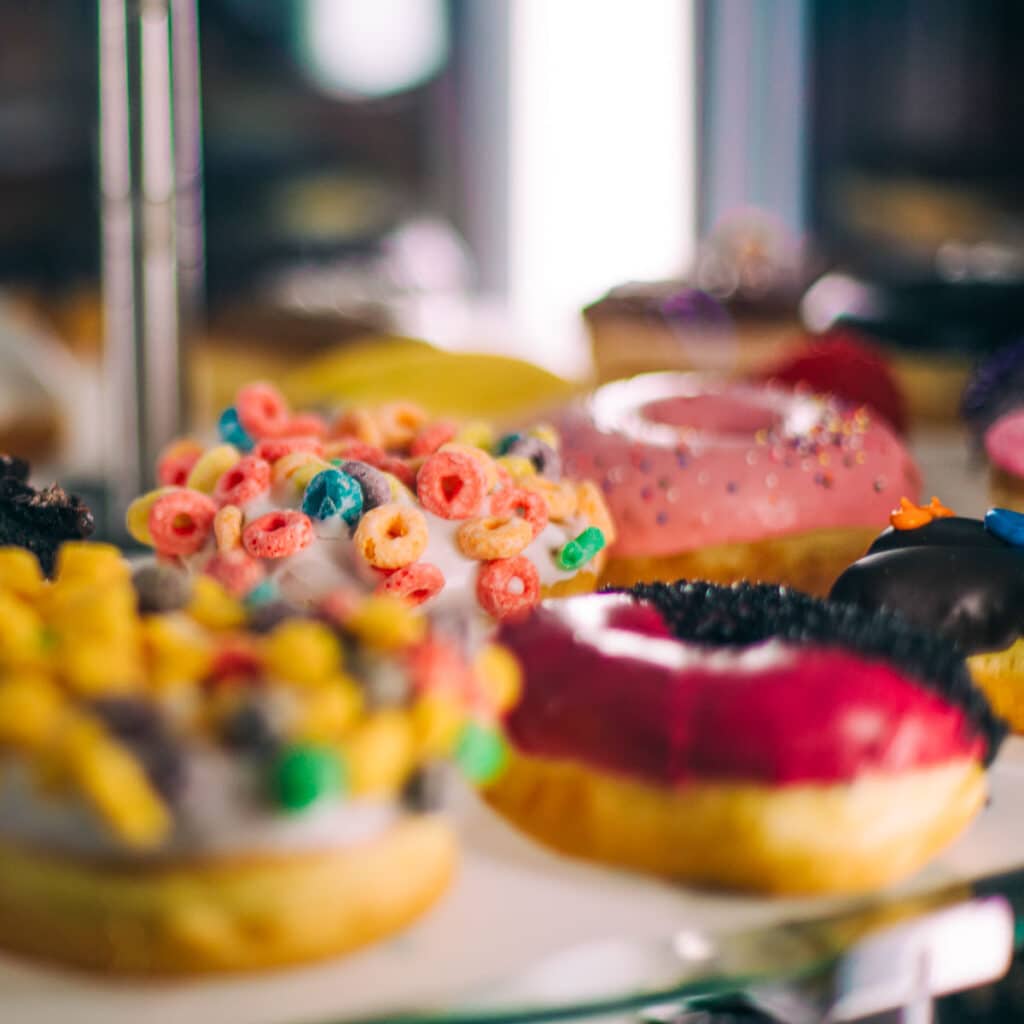 closeup of donut case inside Voodoo Doughnuts in Portland, Oregon