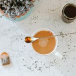 tea with spoonful of syrup, jar or earl grey syrup, tea bag, and pot of lavender