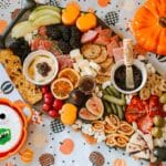 char-boo-terie board on a coffin shaped platter beside mummy brie with candy face and pipkin shaped pot