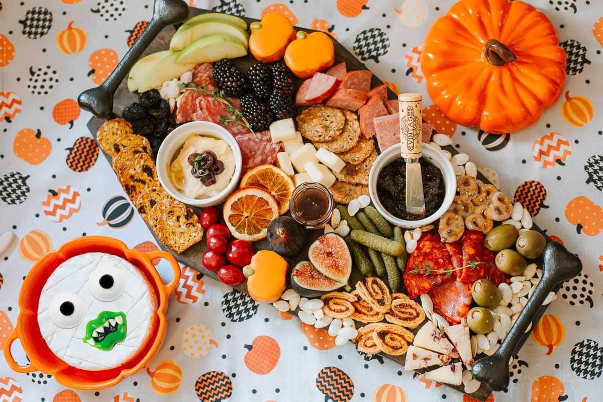char-boo-terie board on a coffin shaped platter beside mummy brie with candy face and pipkin shaped pot