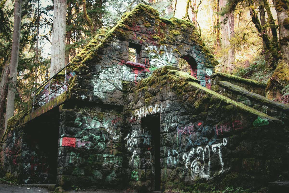 Witch's Castle, a stone structure in ruin, covered with moss and graffiti