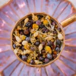 loose leaf juniper berry tea ingredients in purple teacup