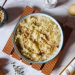 truffle mashed potatoes with potatoes, herbs, nut mixture, truffle oil bottle.