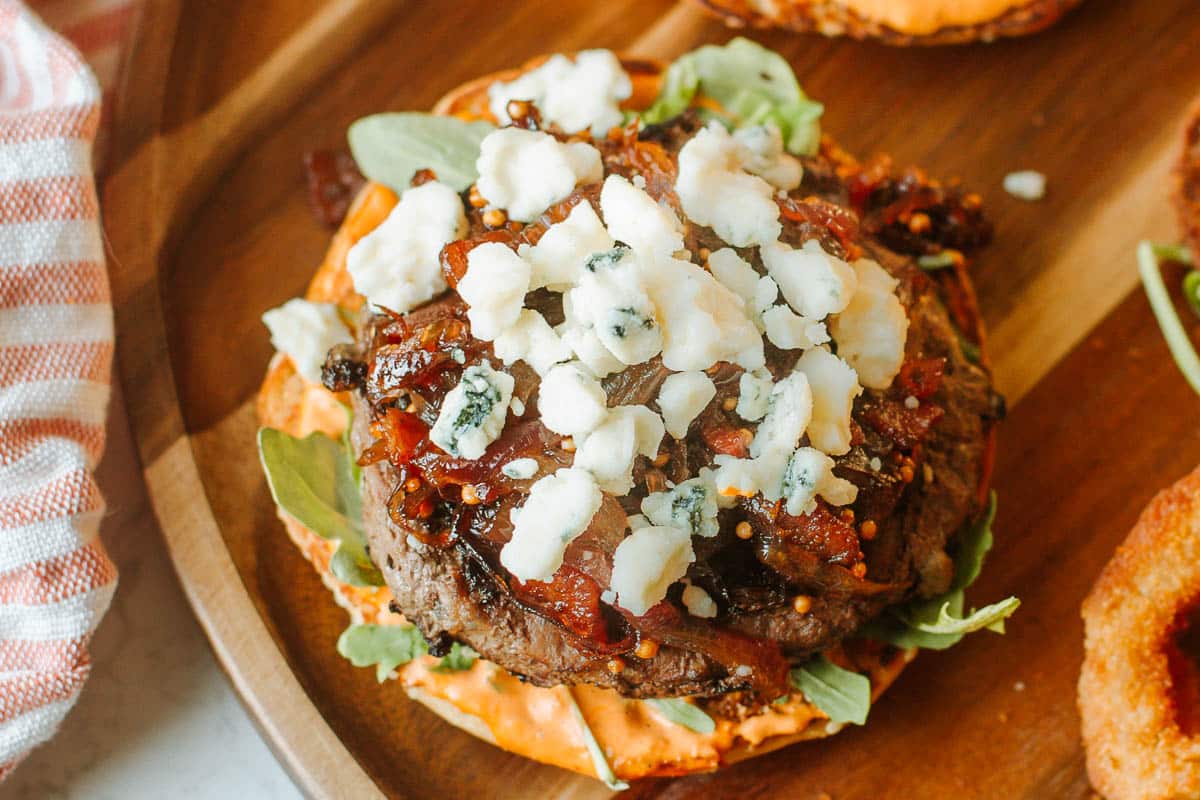 burger topped with caramelized onion jam and blue cheese crumbles.