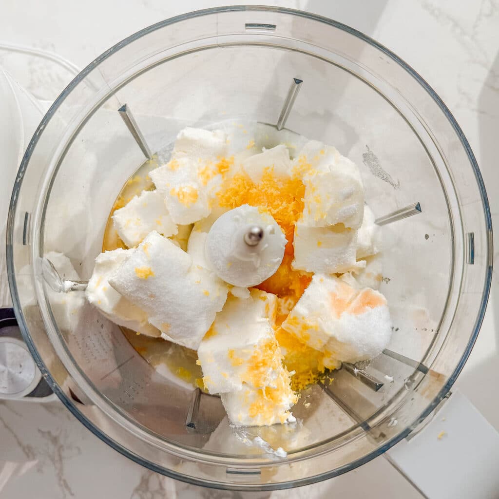 cheesecake ingredients in food processor before mixing.