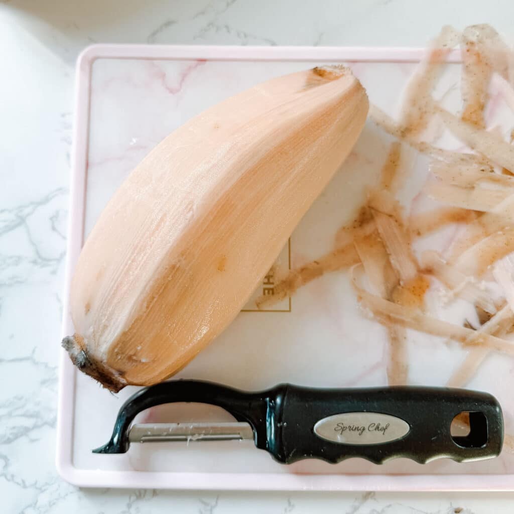 peeled lotus root with vegetable peeler.