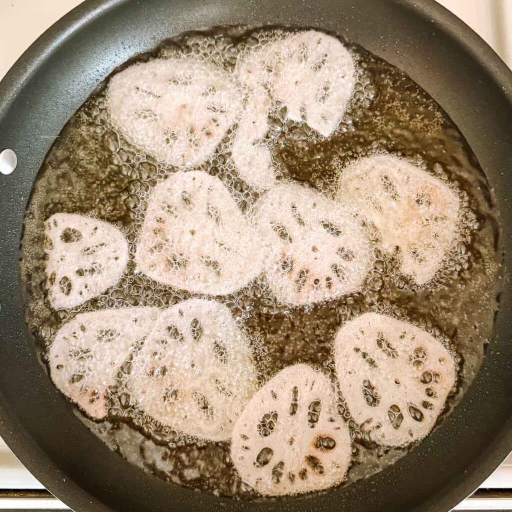 lotus root chips frying.