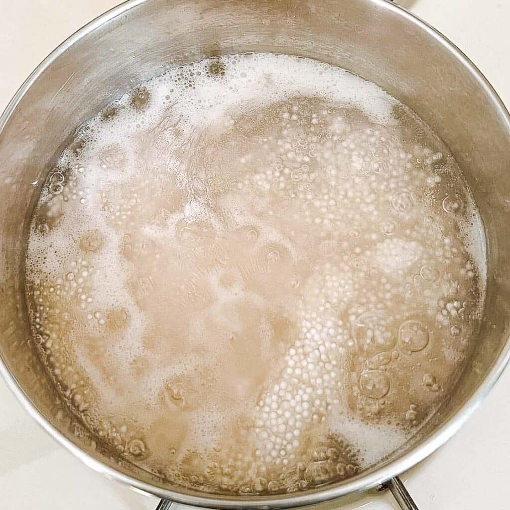 sago pearls boiling in pot.